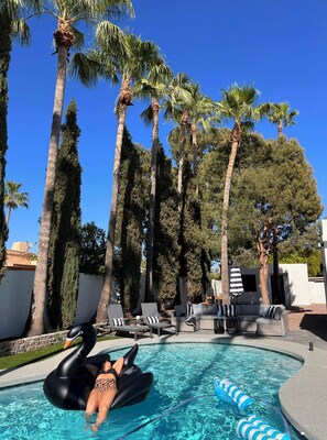 Outdoor pool, a heated pool, sun loungers