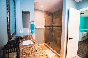 Shower, hair dryer, towels, shampoo