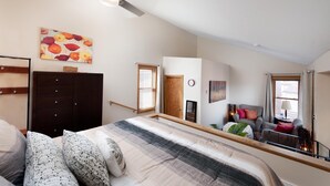 A bedroom with a bed, a dresser, a ceiling fan, a painting, a window, and a door. - Durango Townhome w/ Pool/Hot Tub | Near FLC, Town, Golf & Trails (Durango)