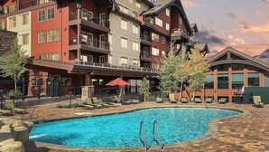 A hotel with a pool area, outdoor seating, and a mountain view. - Double Diamond | Walk to Ski Lift & Pool Access - Mtn Views, Fireplace (Durango)