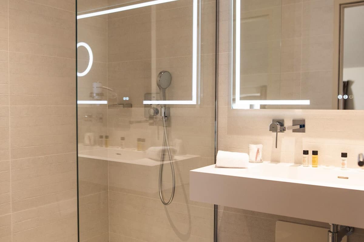 junior quadruple room | bathroom | shower, rainfall showerhead, hair dryer, bathrobes