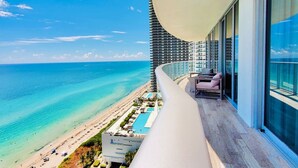 A high-rise hotel with a balcony overlooking a beach and a pool. - BeachFront Luxury Hotel | 3B OceanView Hyde Resort (Hollywood)