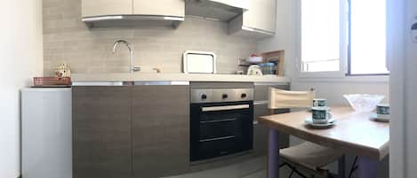 Fridge, oven, cookware/dishes/utensils