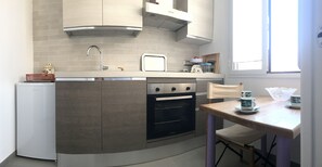 Fridge, oven, cookware/dishes/utensils