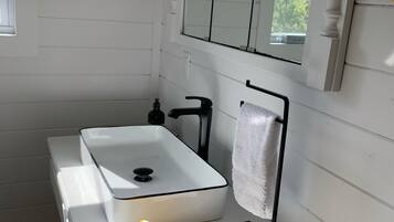 Combined shower/tub, hair dryer, towels, soap