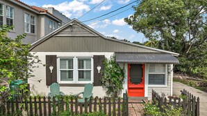 A single-story house with a red door, a picket fence, and a small porch. - Location! Location! Location! In the middle of Downtown Mt Dora!  (Mount Dora)