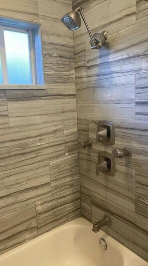 Combined shower/tub, hair dryer, towels, soap