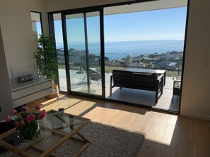 Relax in this serene space with a sliding door leading to a peaceful outdoor area.