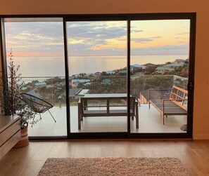 Enjoy a serene atmosphere in this room with an outdoor space featuring a view of the coastal landscape.