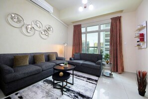 Standard Apartment | Living area | LCD TV - Premium 1 BHK in La Vista Silicon Oasis (Dubai)