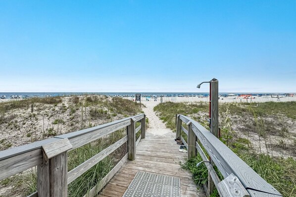 Multiple Beach Accesses with showers and hoses.