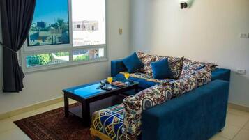 Deluxe Apartment, 2 Bedrooms, River View | Living room | 32-inch LCD TV with satellite channels, TV