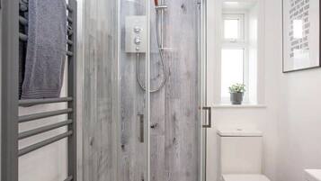 Shower, hair dryer, towels, soap