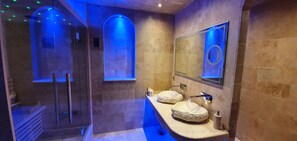 A modern bathroom with a glass shower enclosure, two large sinks with stone basins, and a large mirror. - Loveroom La Garçonn'hyeres (Hyères)