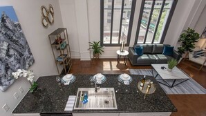 A modern kitchen with a granite countertop, built-in dishwasher, and a large window offering a view of the city. - Downtown Fort Worth Luxury Loft in Sundance Square (Fort Worth)