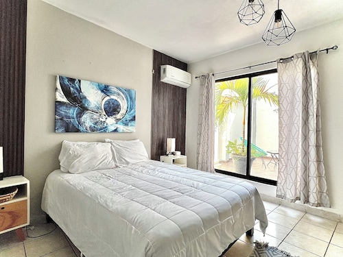 Comfortable modern apartment conveniently located for shopping and dining.