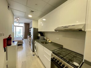 Studio (0 Bedroom) | Private kitchen | Microwave, oven, stovetop, dishwasher - Spacious & Cute Studio with Balcony (Dubai)