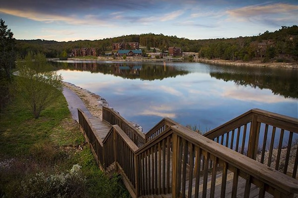 Wider view of the lake overseeing the Stonebridge Pavilion in the footbridge