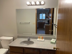 Combined shower/tub, hair dryer, towels, soap