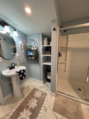 Shower, hair dryer, towels, soap