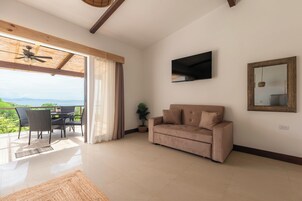 Deluxe Room, Balcony | Living area | 32-inch Smart TV with cable channels, TV