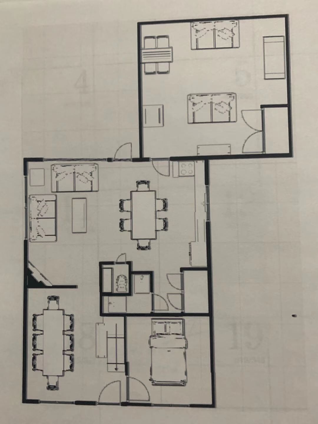 A floor plan with a dining area, kitchen, and a bedroom.