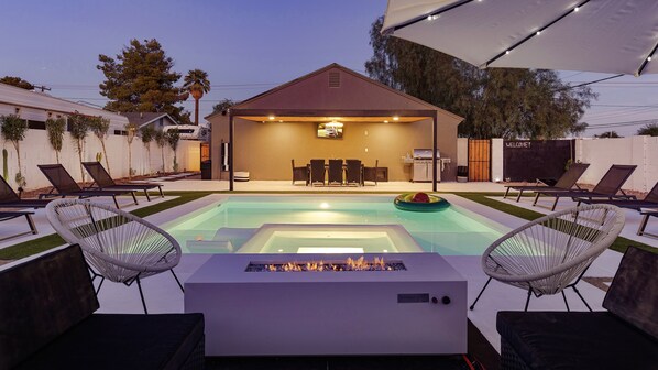 Outdoor pool, a heated pool, pool loungers