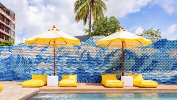 Outdoor pool, open 8:00 AM to 8:00 PM, pool loungers