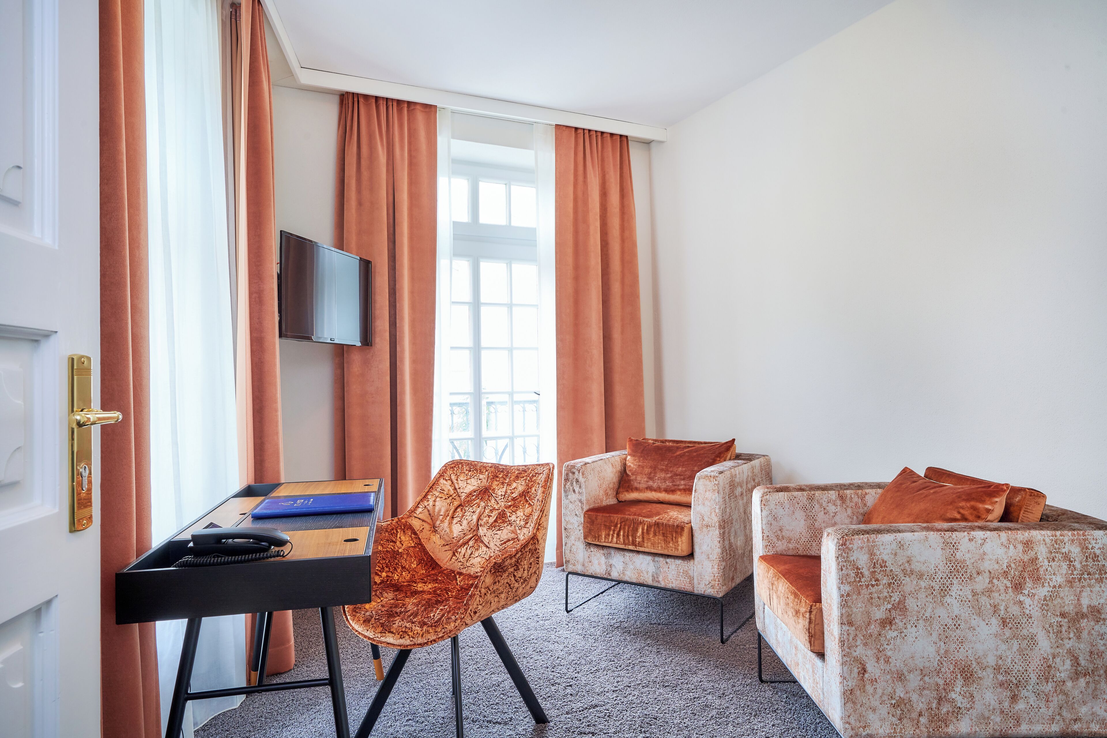 junior suite, 1 king bed, bathtub, city view | living area | 50-inch smart tv with cable channels, tv