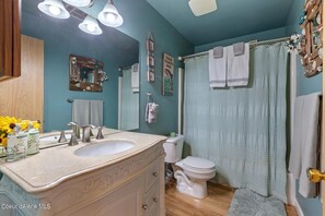 Combined shower/tub, hair dryer, towels, soap