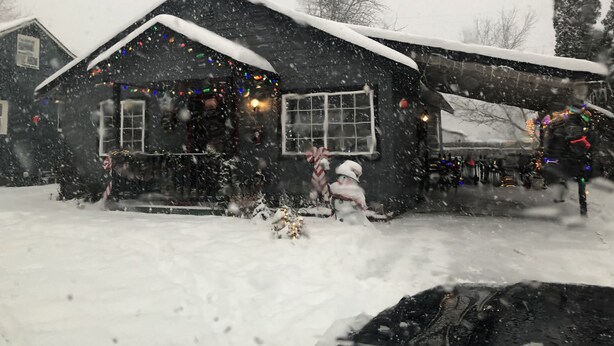 A house with a snow-covered roof and a porch. - Almost paradise (Coeur d'Alene)