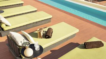 Outdoor pool, open 9:00 AM to 10:00 PM, pool loungers