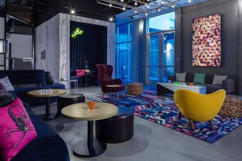 Hotel entrance and lobby at Aloft Savannah Airport