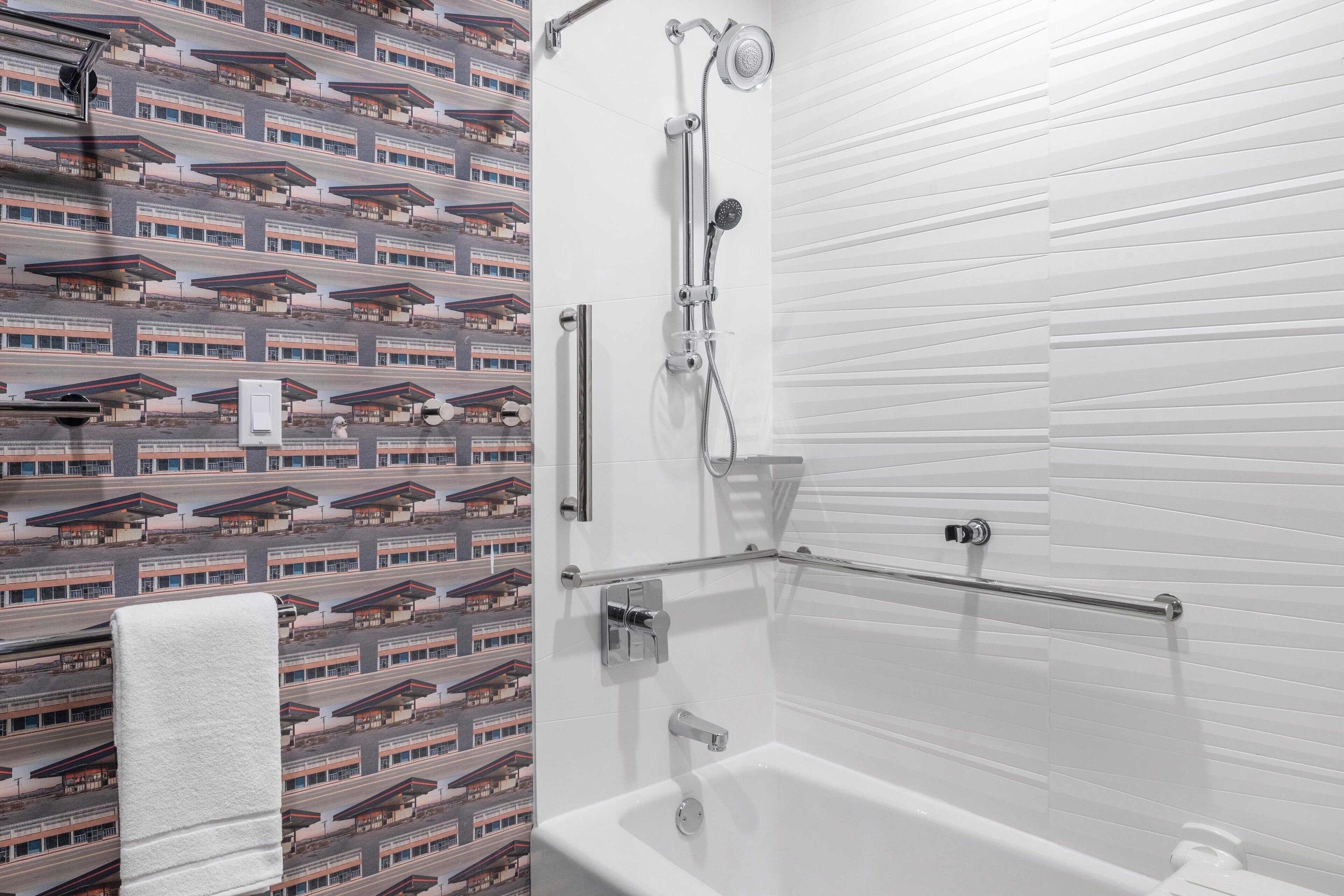 designer toiletries, hair dryer, towels, soap