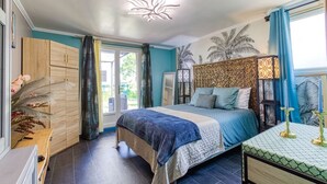 A bedroom with a bed, a nightstand, a wardrobe, and a window with curtains. - Pleasant studio of the Daudou with shared swimming pool and jacuzzi. (Septfonds)