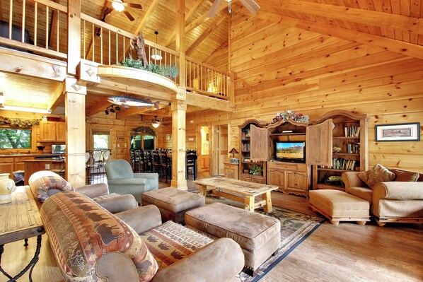 Flat-screen TV, fireplace, foosball, books