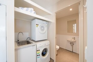 Bathtub, towels, toilet paper
