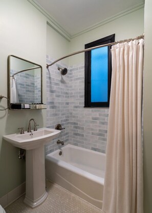Combined shower/bathtub, hair dryer, towels, soap