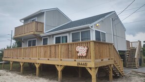 A two-story wooden house with a balcony and a sign that reads "Cottage de Coq." - 3 MIN. WALK TO THE BEACH!  South Nags Head  (Nags Head)