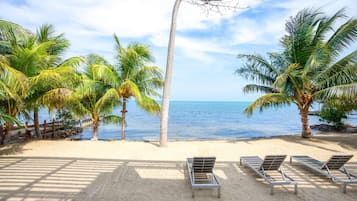 On the beach, sun loungers, beach towels