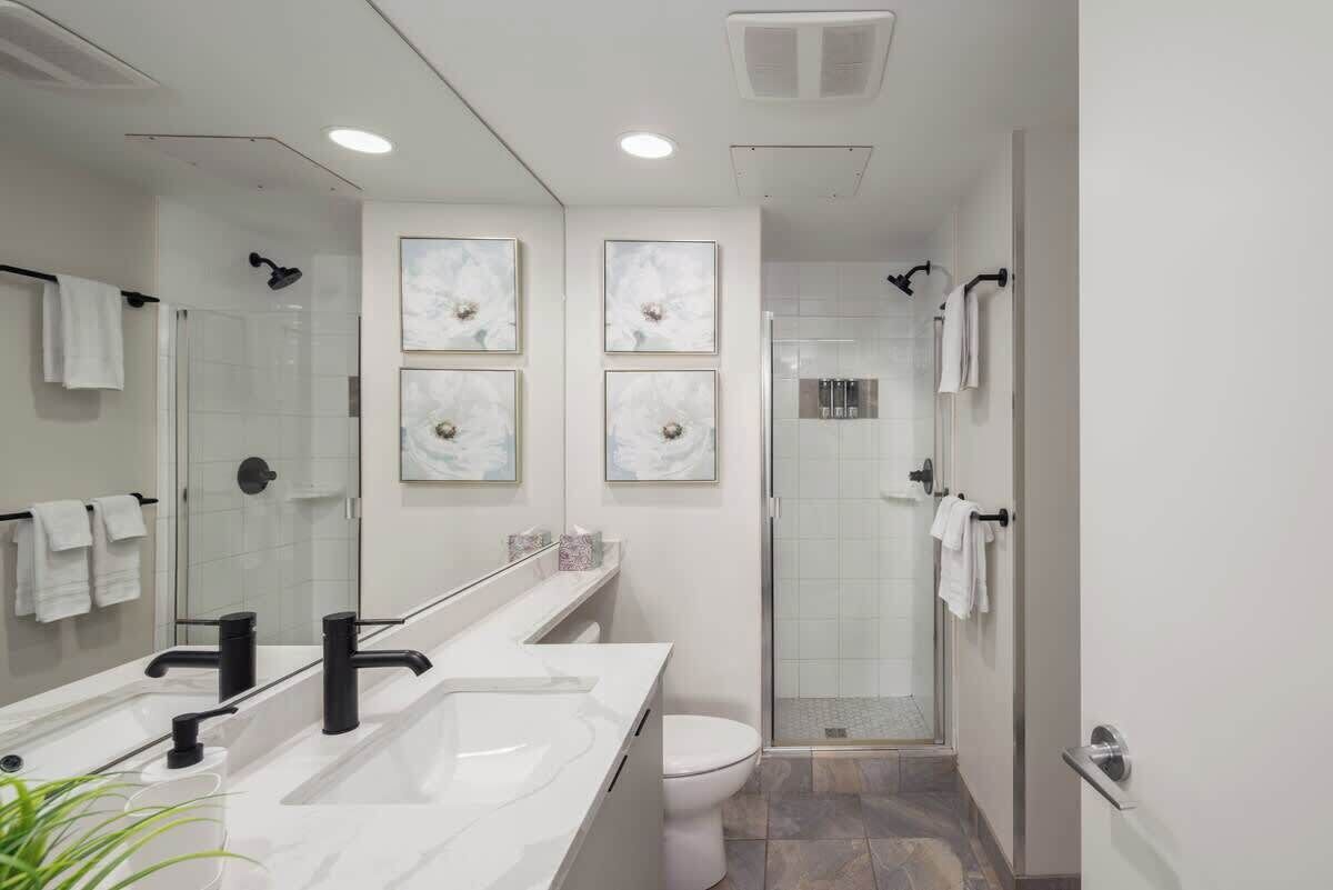 Combined shower/tub, hair dryer, towels, soap