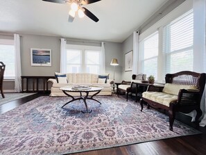 Living room with Roku TV and dedicated workspace