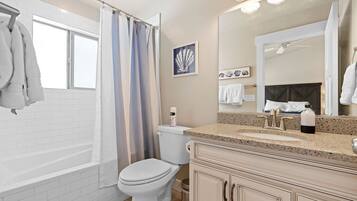 Bathtub, towels, soap, shampoo