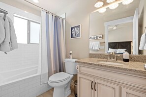 Bathtub, towels, soap, shampoo