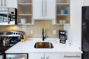 Remodeled and updated kitchen...new solid stone counters and brand new cabinets.