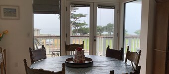 Beachfront home directly across from beach & park! Close to everything!