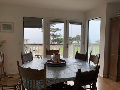 Beachfront home directly across from beach & park! Close to everything!