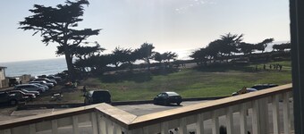 Beachfront home directly across from beach & park! Close to everything!