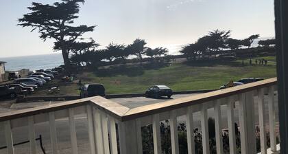 Beachfront home directly across from beach & park! Close to everything!