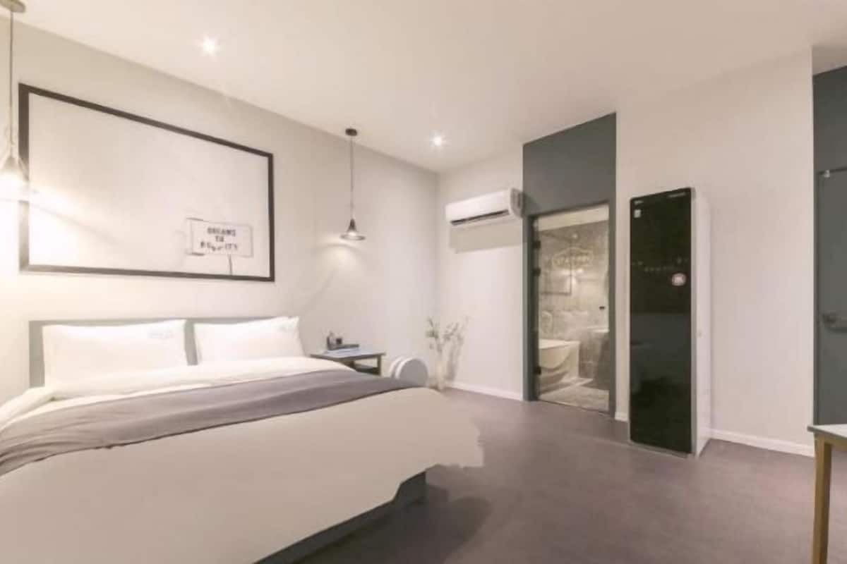 Premium bedding, memory foam beds, desk, laptop workspace